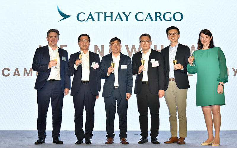 Director Cargo Tom Owen (left) leads the toasts with (left to right) Airport Authority Hong Kong CEO Fred Lam, Secretary SH Lam, Hong Kong Civil Aviation Department Director-General Victor Liu Chi-yung, and the Cathay Pacific Group's Chief Executive Officer Ronald Lam and Chief Financial Officer Rebecca Sharpe