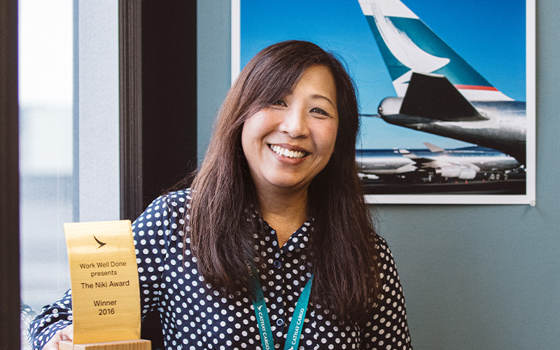 Cargo Services Lead Agent May So shows off the Niki Award won by the Anchorage team in 2017 when they looked after passengers from a flight to Los Angeles that diverted to a military base some 1,500 miles from Anchorage